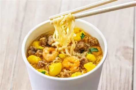 Classic Japanese Cup Noodle topped with shrimp, egg, beef, and green onions — a flavor-packed instant meal ready in minutes.